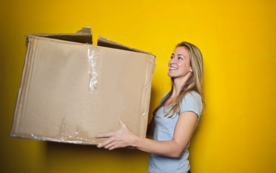 A women holding a box and deciding eCommerce Shipping Integration is Right for her.